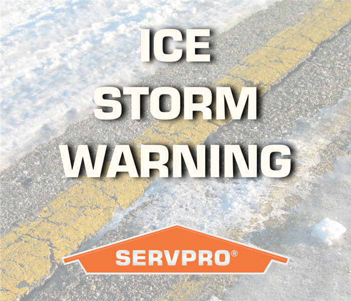 Blured out road with ice and snow covering it. Orange SERVPRO logo at bottom of photo, with the words "Ice Storm Warning"