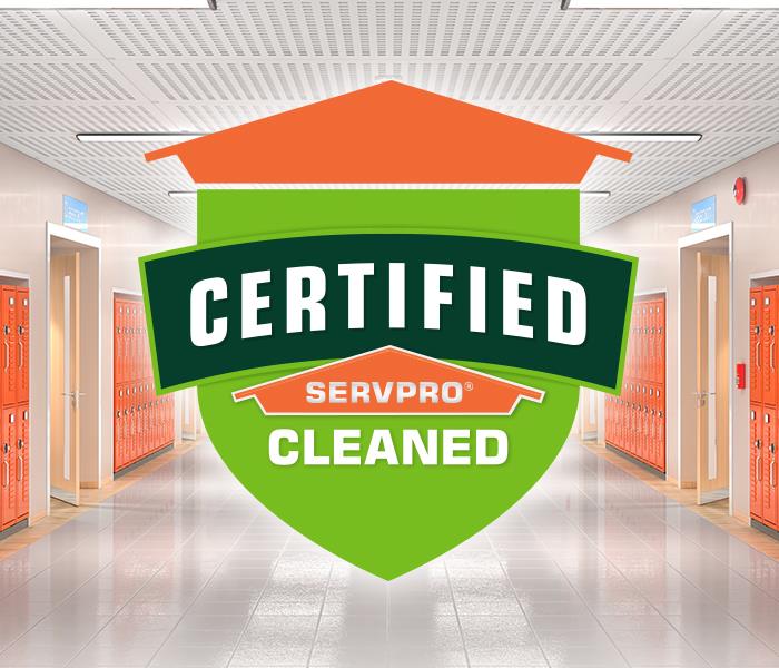 Graphic of a SERVPRO shield that says "Certified SERVPRO Cleaned" with a school hallway in the background with orange lockers